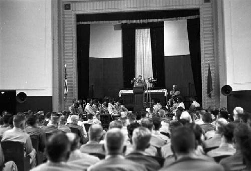 Soldier at podium adressing soldiers in auditorium 2