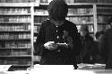 Young boy flipping through book