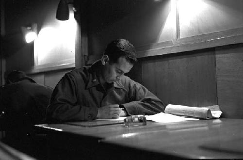 Soldier studying at work table