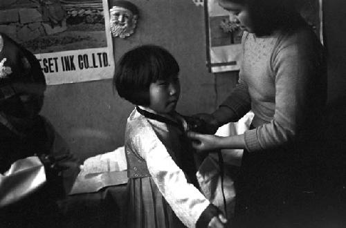 Girl being fitted for dress