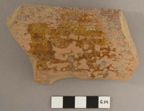 Ceramic sherd with some red glaze