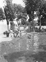 Boys bathing in village pool