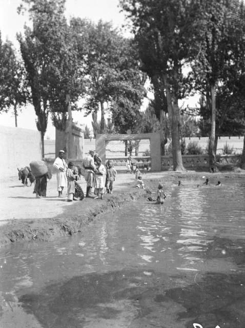 Boys bathing in village pool