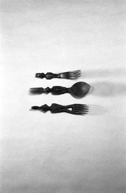 2 wooden forks and combination fork and spoon