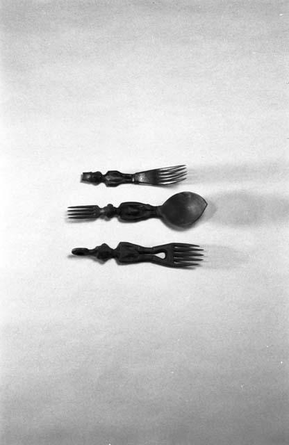 2 wooden forks and combination fork and spoon