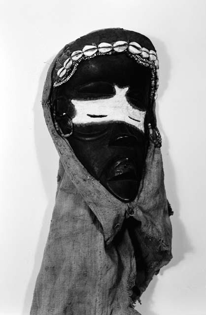 Black wooden mask with cloth headdress