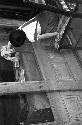 Girl sitting on chair wiping window