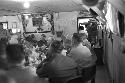 Soldiers at table looking ahead listening