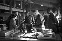 Portrait of soldiers standing by serving table