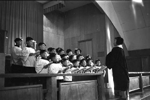 Conductor leading choir