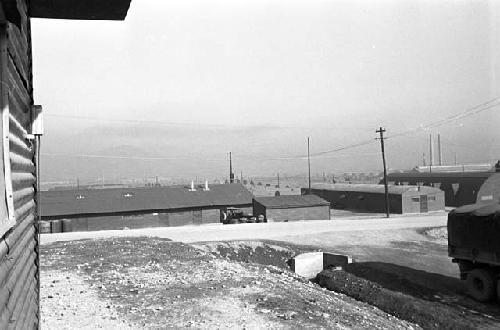 Dirt road and Barracks in background