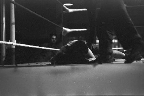 Boxer laid out on canvas in ring 3