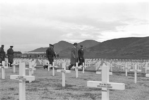 Whitcomb (rear center) guiding General Hulls and Ridgeway through the United Nations Cemetery near Pusan