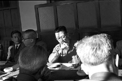 Portrait of men at table during meeting