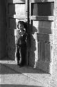 Portrait of little girl outside leaning in front of doors