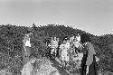 Women and children walking down hill