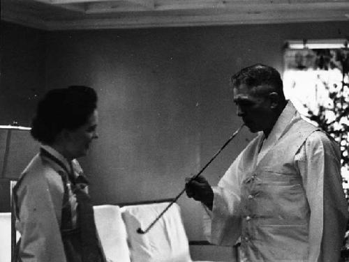 General Whitcomb smoking pipe, standing next to Lieutenant Martha Voyles, Christ