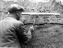 Layers with ruler and 1 crew member scraping wall, deposit layers