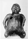 Kneeling human effigy figure