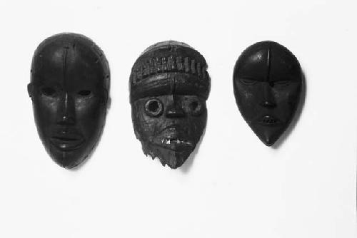 Three wooden masks