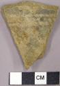 Sherd with black on white interior geometric designs