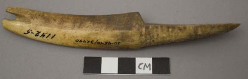 Utilized ivory, worked, notched at one end and incised at other end