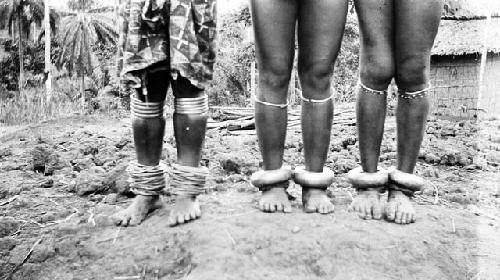 Three women wearing anklets