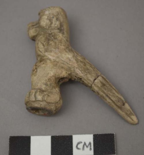 Carved bone bird figure