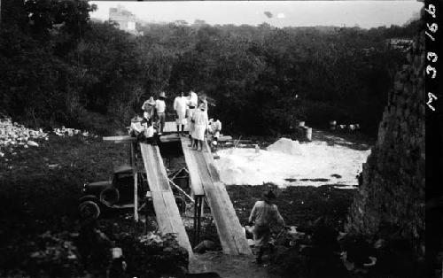 Dr. Morris Steggerda measuring workmen on dump hopper