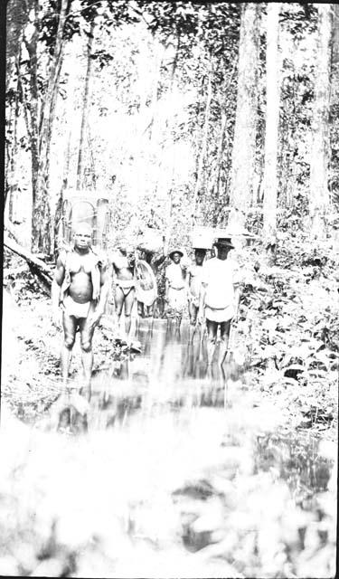 Men standing in stream