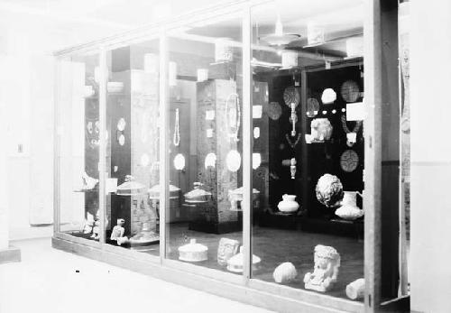 Case in Room 35 of Peabody Museum showing  Maya pottery, jade