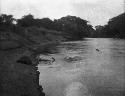 Men walking along riverbank at Cocle