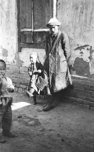 Chantos (Uighur), man and two boys with head coverings