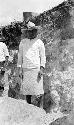 Man standing in trench at Temple of Wall Panels