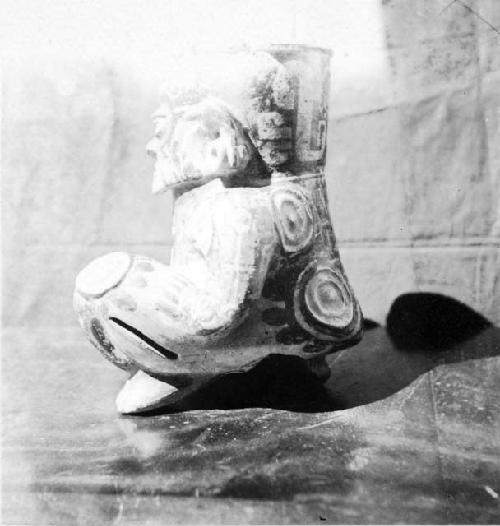 Kneeling human effigy figure