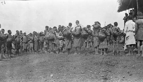 Group of boys carrying bags