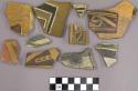 Polychrome sherds with geometric designs and bands on one side