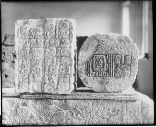 Block of stone with incription, altar F and circular stone with glyphs, altar W