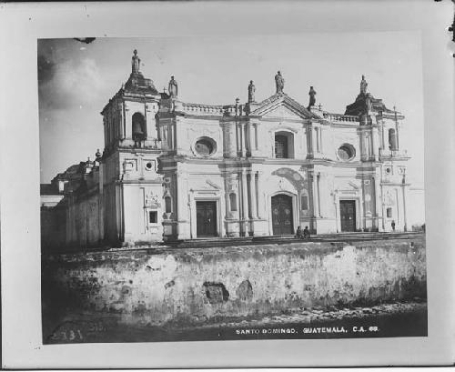 Two men siiting on steps of church in Guatemala