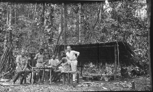 Men gathered in the jungle