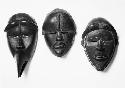 Three wooden masks