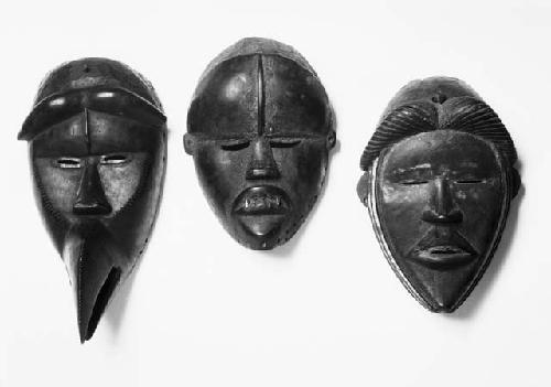 Three wooden masks