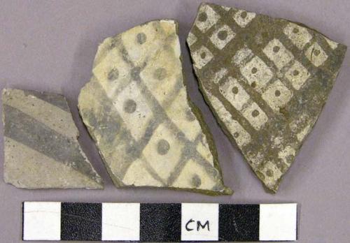 Sherd with black on white geometric designs