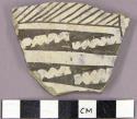 Sherd with exterior black on white geometric designs