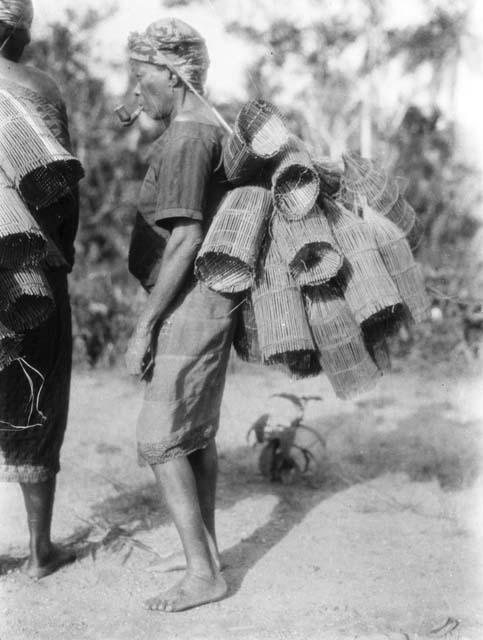 Woman on the way to stream to set shrimp and crab traps