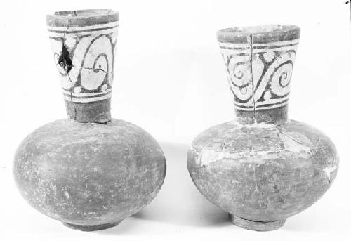 Two red carafes with polychrome necks and ring bases, grave 4, numbers 10, 6