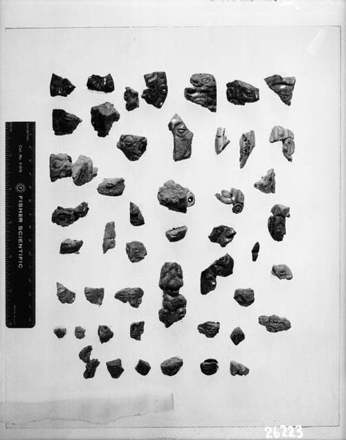 Jade fragments and human faces, low relief