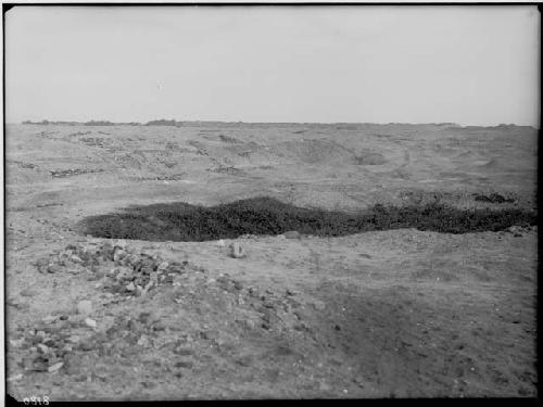 Rivero group showing the northeast and northwest background; foreground has remain of common houses and necropolis