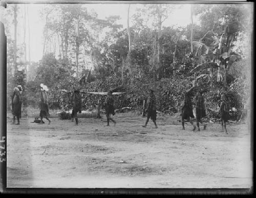 Line of men dancing