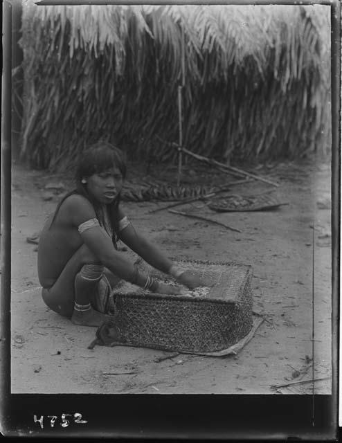 Girl sifting cassava